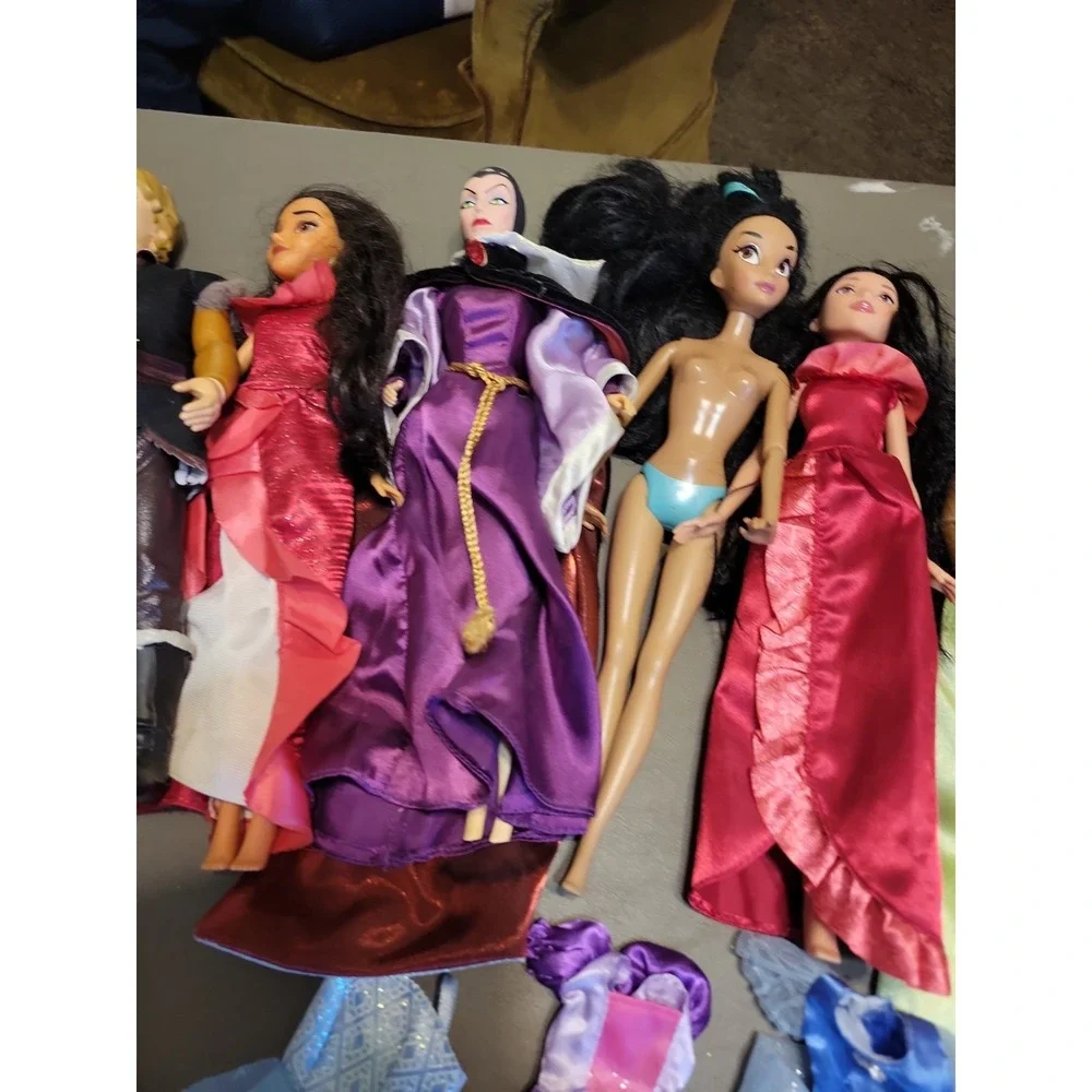 Disney Barbie dolls with extra dresses shoes etc... Mixed lot